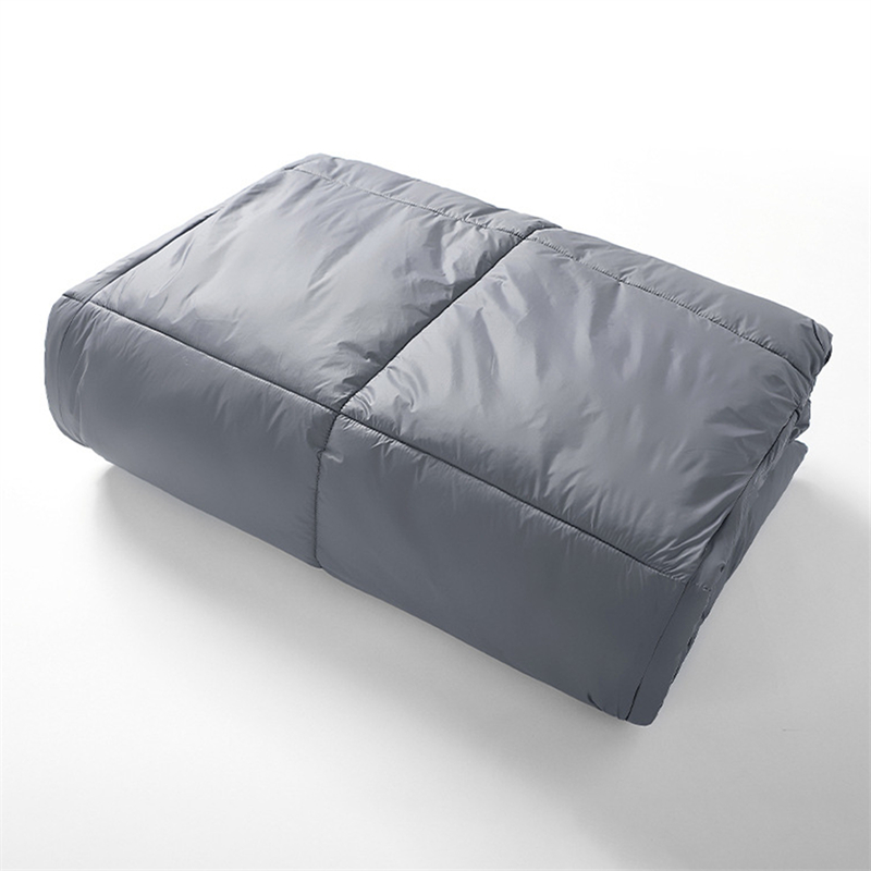 A portable grey blanket folded for easy carry anywhere.